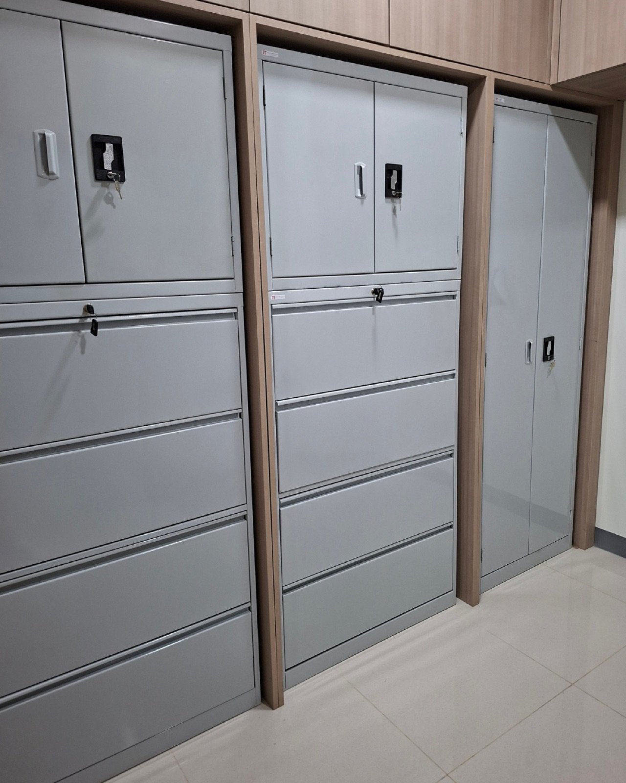Built-in gray steel cabinets with drawers and swing doors