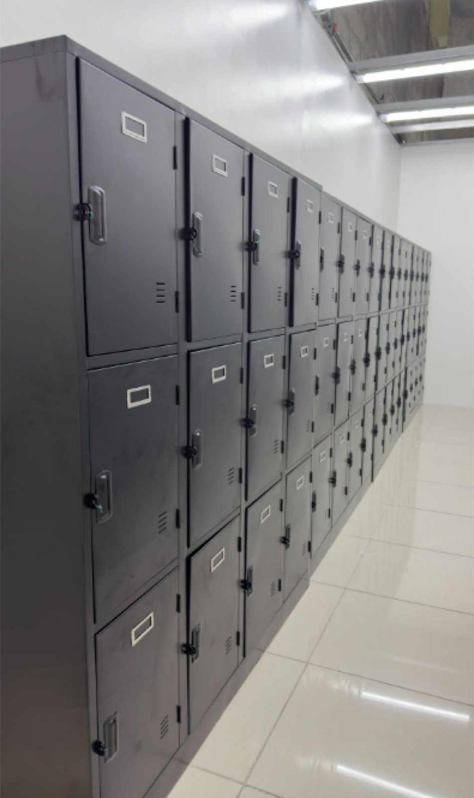 Row of gray steel lockers with key locks