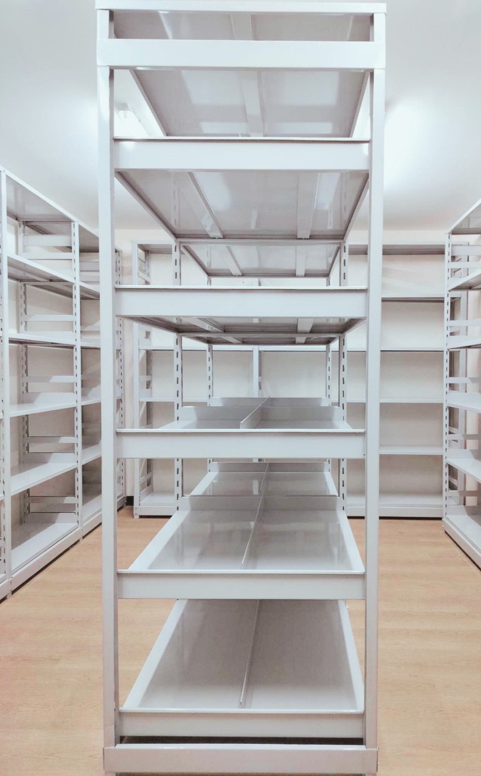 White multi-level steel shelving rack